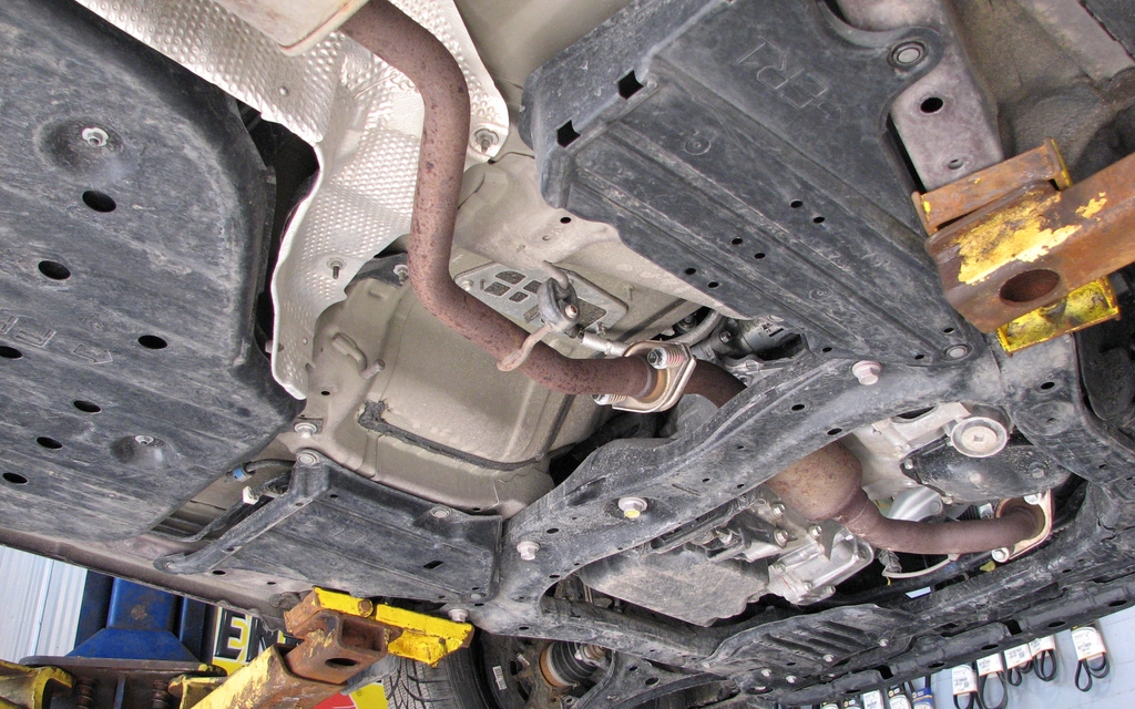  There are several plastic covers protecting the mechanical parts under the vehicle. Some even act as a shield over other parts. 
