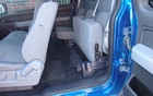 Ford F-150 STX 4x4 2011. Les outils pour changer une crevaison se trouvent sous le siège arrière gauche.