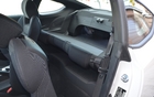 2013 Hyundai Genesis Coupe 2.0T. The rear seat back folds down, but just in one piece, making the vehicle even less versatile.  
