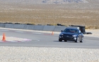 2013 Hyundai Genesis Coupe 3.8 GT. On the track, the suspension did a very good job keeping roll under control. That said, this V6 version is more comfortable on the highway.