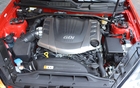 2013 Hyundai Genesis Coupe 3.8 GT. The 3.8L V6 with direct injection (GDI) delivers 348 horsepower and 295 lbs.-ft. of torque.  