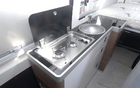 The propane stove and sink are on the right side 