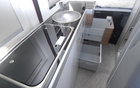 There are numerous storage and work spaces 
