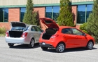 Tough to compare a sedan and a hatchback. Although the Sonic sedan’s trunk is big for the category, it doesn’t measure up to the Mazda’s larger and more versatile trunk.