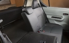 The rear seat back folds down, even though there is a battery powering the electric motor. 