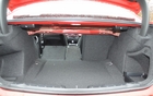 The seatbacks lower in three parts, which is very practical when the car has to transport a driver, three adults and a 2x4.