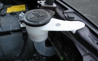 Accessing the windshield washer fluid is easy thanks to the fact that the cap is located in front of the engine compartment. The assembly looks a little fragile, but it is probably good enough. 