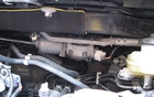 Deep in the engine compartment, practically under the dashboard, is the motor for the windshield wipers. Anyone needing to work on this part has the right to gripe about it! 