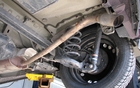 The muffler is located at the centre of the vehicle, which is rather unusual. Thus, there is a long pipe extending to the back, below the rear bumper. 