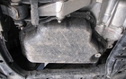 The CVT transmission’s small oil tank and drain plug. 