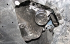  Under the vehicle, accessing the oil filter is easy – you just have to remove a plastic cover. Unlike on the Mazda3, the opening is directly across from the filter. 