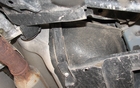 In the centre of the photo, we see part of the gas tank. It was designed to go around the transmission shaft. 