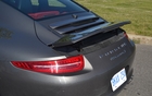 The spoiler is deployed either automatically or manually