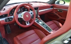 The central console houses a series of controls inspired by fighter plane instrumentation.