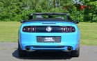 With the top down to take advantage of the summer.