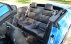 The very narrow backseats are easier to access when the top is down.
