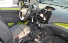 It has a bare bones but practical dashboard. Many controls are found in the central touch screen.
