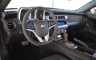 The ZL1’s passenger compartment is more luxurious than that of the other Camaros. The dashboard is covered in suede.