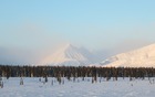 Snow blows from peak-to-peak in the Alaska Range.