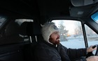 Paying close attention to the Alaska highway ahead.